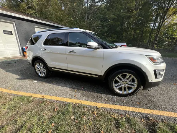 White Ford Explorer after a detail, parked on a driveway