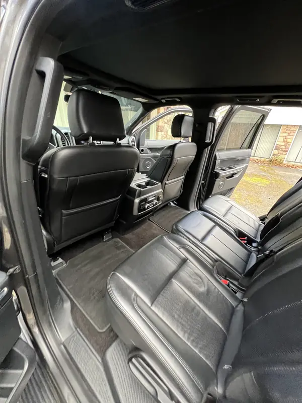 Clean black leather seats and carpets inside an SUV